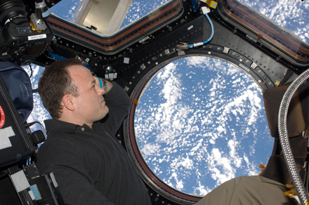 Ron Garan looking out the ISS windows